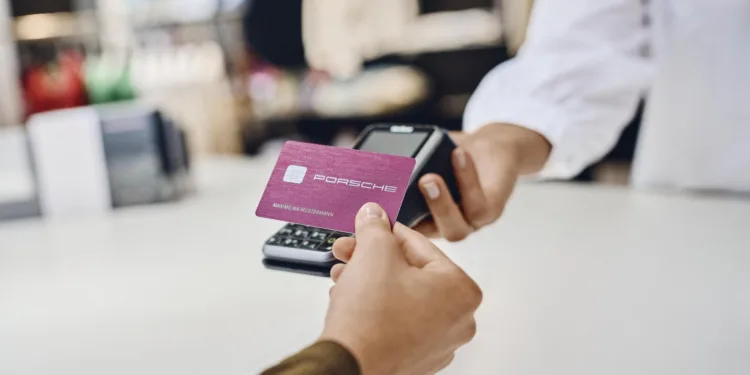 Metal Porsche Card issued with travel perks and charging access