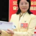 CALB chairwoman Liu Jingyu with solid state battery. — Image from Sina