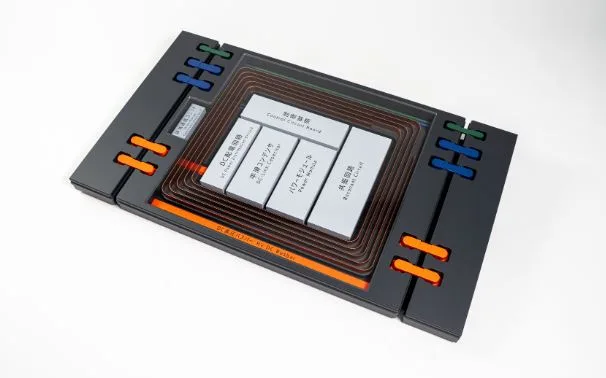 Transfer unit embedded in the road.