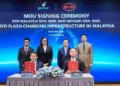 Gentari group CEO Sushil Purohit and BYD Malaysia managing director Jacob Ma showing the signed documents in Shenzhen. Behind them (from left) are Gentari chief green mobility officer Fadzrul Ahmad, Petronas senior vice president for corporate strategy Marina Md Taib, BYD chairman and president Wang Chuanfu and BYD vice president Liu Xueliang.